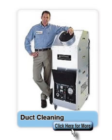man_standing_by_the_duct_cleaning_machine
